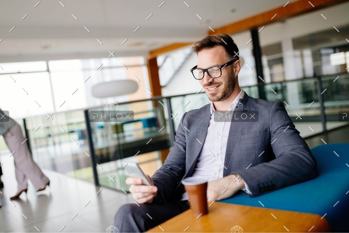 demo-attachment-502-businessman-taking-a-break-with-a-cup-of-coffee-JW4B3DH